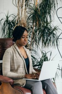 man sitting in a chair working in an office